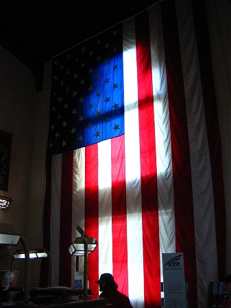 Sunlight provides an interesting backlit glow on this American Flag.