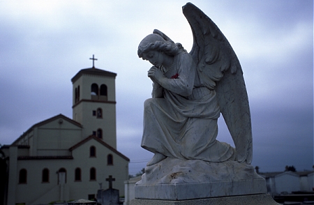 An angel grave marker in a cemetery in Watsonville, CA.