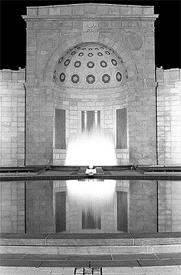 A floodlit fountain in Arlington cemetery in Arlington, Va.