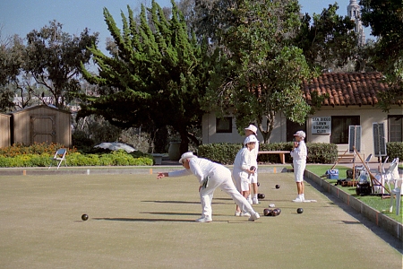 A player rolling a jack at the San Diego Lawn Bowling Club in Balboa Park.
