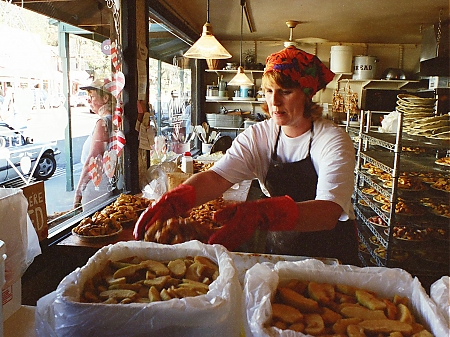 A woman making apple pies at Mom's Apple Pies in Julian, California