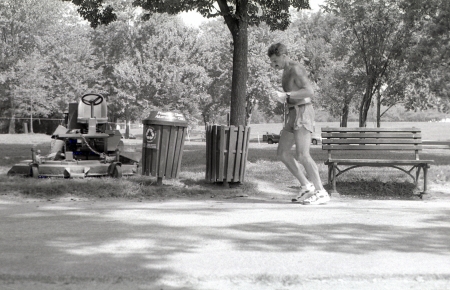 A photograph of a man jogging on a trail near the National Mall in Washington, DC