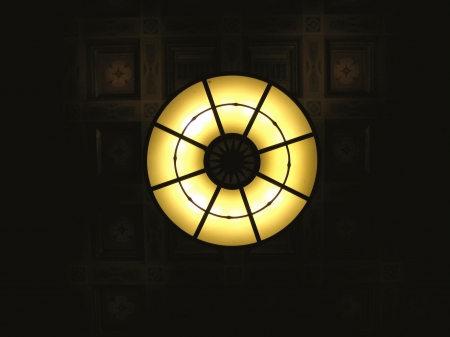 A massive and ornate overhead light in the waiting room of the Los Angeles Union Station.