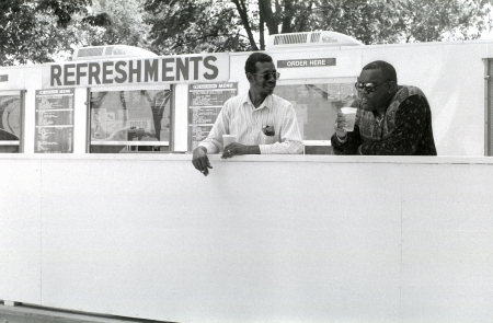 Two men drinking beers and talking near the Mall in Washington, D.C.