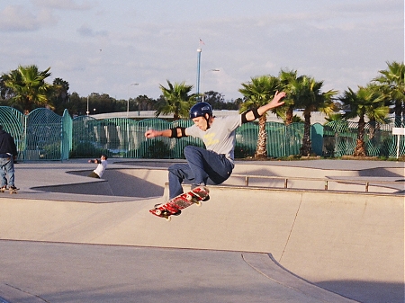 A skater airing a bowl in the Ocean Beach Skate Park in San Diego, CA.