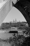 A view of Georgetown University including the Georgetown boathouse from under the Key Bridge.