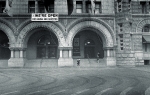 A view of a woman waiting at the base of the steps of the Old Post Office Pavilion in Washington, D.C.